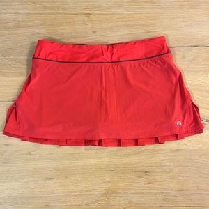 Lululemon running/tennis skirt. Size 8. Color is an orange/red color